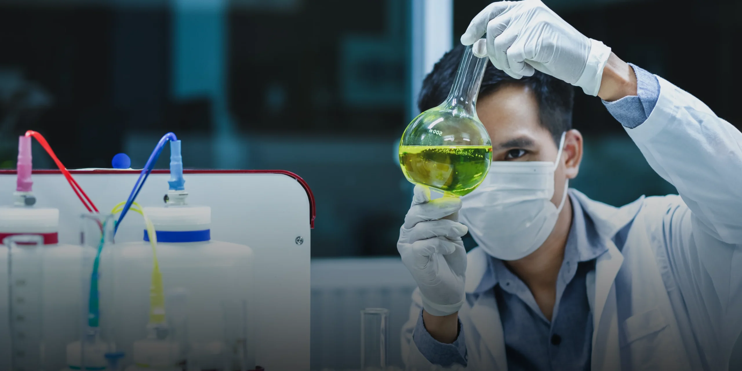 Male scientist looking at a solution in his lab representing secondary pharmaceutical patents in Southeast Asia | KASS Malaysia