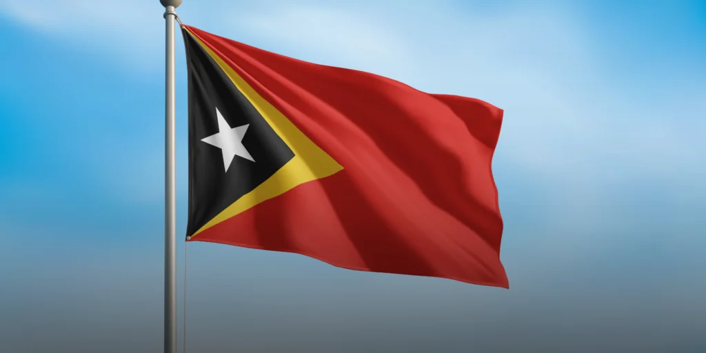 A picture of a waving Timor-Leste flag representing how Timor-Leste has business potential for business owners | KASS Malaysia Southeast Asia ASEAN