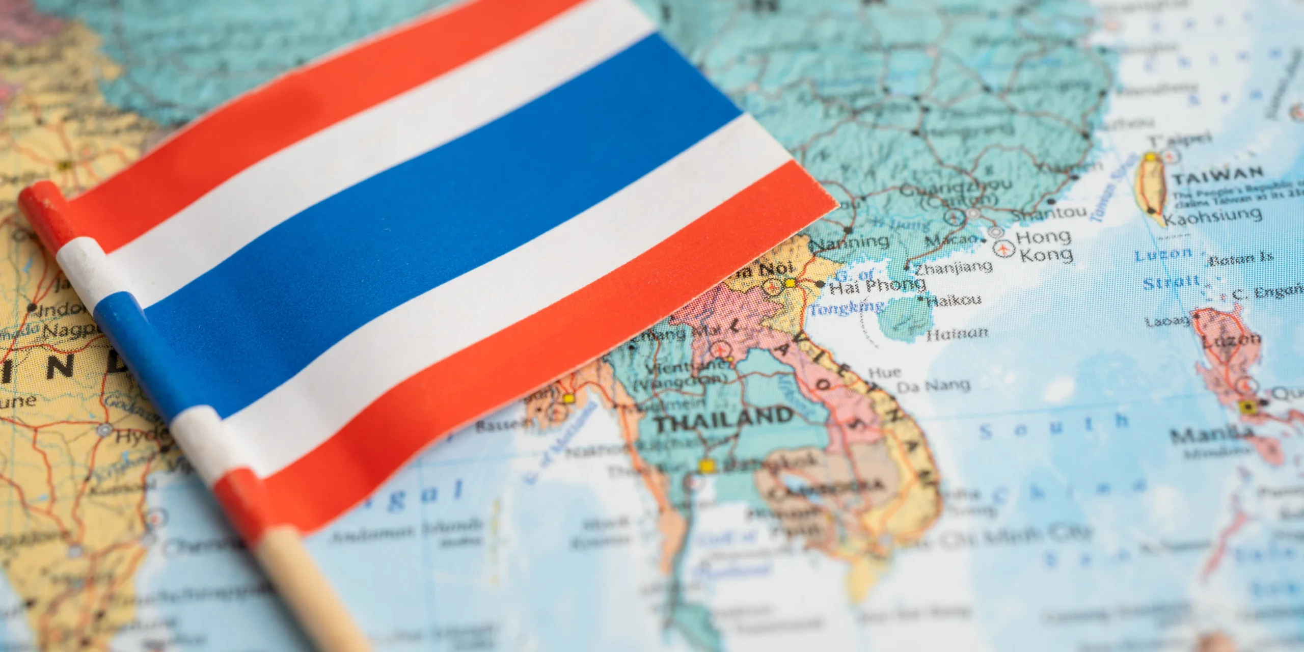 Thailand flag and map of Thailand representing the country’s patent landscape and intellectual property. KASS International